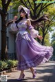 A woman in a purple dress and hat is walking down the street.